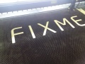 Laser cut cardboard Fixme logo.jpg